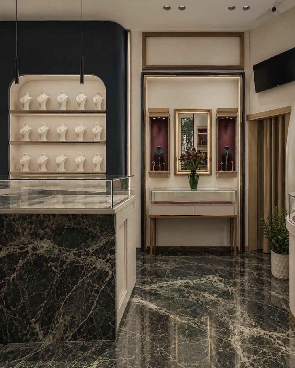 Imania gallery interior with marble floor and lit display shelves