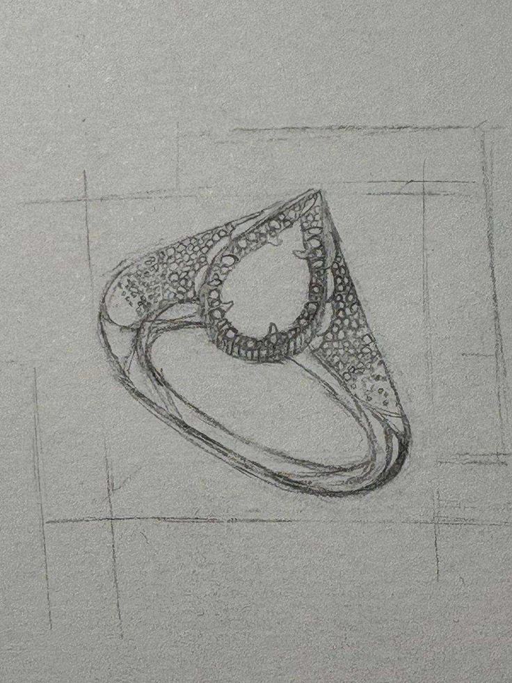 Hand-drawn ring sketch with construction lines